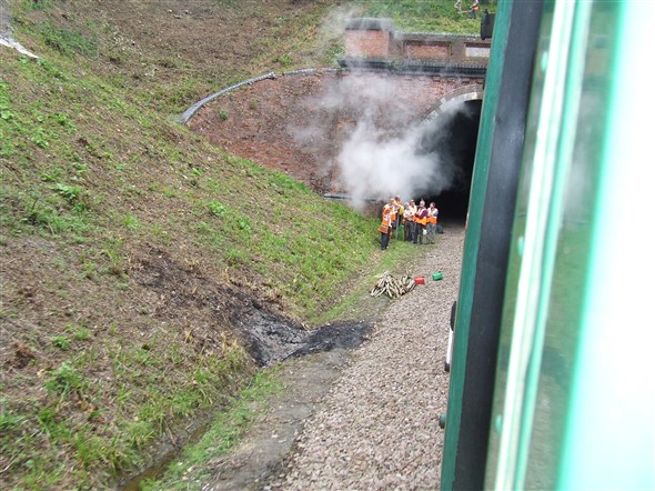 Photo:Workmen at the entrance to Sharpthorne Tunnel, the longest railway tunnel presently in preservation