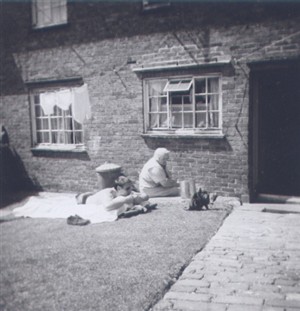 Photo:Ernest Marchant, aged about 20, with mum Ethel in the garden of 4 Twineham Road, c1958